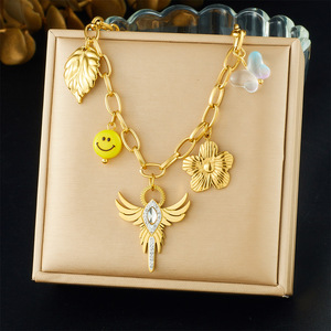 European American <b>Light</b> Luxury Winged Cross Pendant Gold Plated Stainless Steel Necklace With Flower <b>Leaf</b> Smiley Charm - Product Image 1