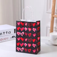 Op maat bedrukte Valentijnsdag hartvormige papieren cadeautas met handvat voor feestelijke cadeauverpakkingen