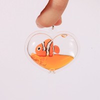 Nouveau design créatif porte-clés en acrylique liquide mignon de dessin animé en forme de cœur avec flotteur en résine 3D, fabrication en gros, cadeau souvenir