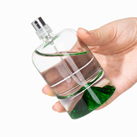 Flacon de parfum rond en verre de luxe 30ml 50ml 100ml avec fond coussiné en forme de cylindre pour l'emballage de cosmétiques et de soins corporels