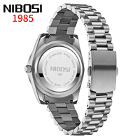 NIBOSI 2627 Reloj clásico de cuarzo para hombre, caja Sunburst, correa de acero, resistente al agua, reloj elegante de negocios para hombre