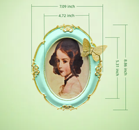 Cadre photo ovale de luxe nordique en résine peinte à la main, papillon 3D, écologique, durable, vert menthe et or, pour présentation sur bureau - Vente en gros