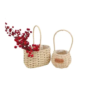 Pastoralism Natural Wedding Party Seagrass Cesta de flores tejida a mano Interior Cesta de flores de plástico impermeable con asa