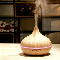 Diffuseur d'huiles essentielles pour la maison, humidificateur en forme d'oignon à grain de bois, machine à parfum à pulvérisation automatique avec veilleuse douce intégrée pour chambre à coucher