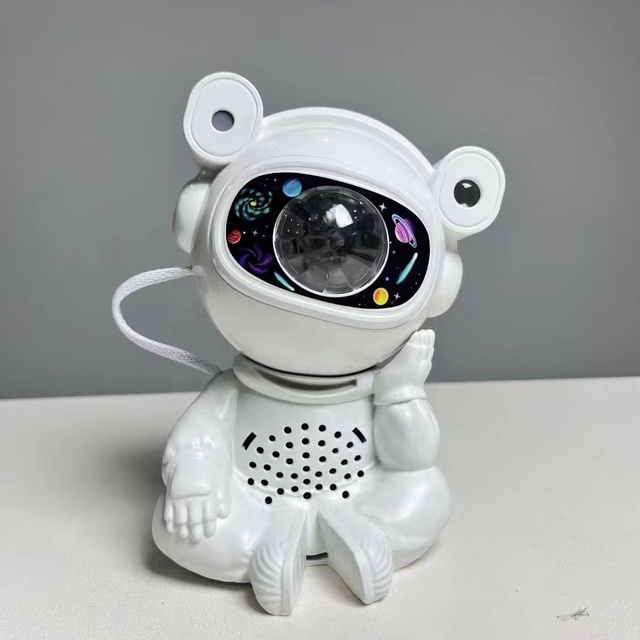 Popular Sitting Astronaut Multi-color Pattern Star Projector LED Night Light With BT Speaker