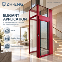 Ascenseur compact pour villa avec cadre rouge personnalisé, vitre panoramique et système de traction, avec gaine intégrée pour villa duplex