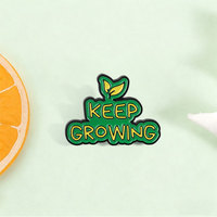 Broche émaillée avec citation inspirante et slogan 'Keep Growing' avec élément feuille de germe, pour revers et accessoire de sac à dos