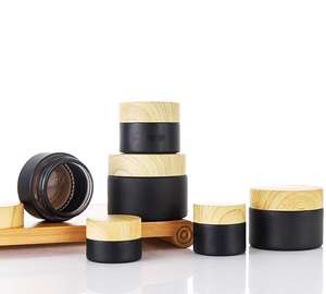 Pot en verre rond noir de luxe en gros avec couvercle en bois 10g 20g 30g 50g pour crème visage et contour des yeux, avec bouchon à vis, emballage carton - Product Image 4