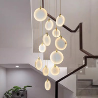 Lustre en marbre cascade de cuivre, luminaire multi-pendent pour plafond haut, escalier, hall de villa