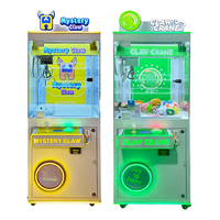 Mini machine à grue de table pour enfants, distributeur de bonbons et jouets, jeu d'arcade domestique avec force de griffes réglable et musique