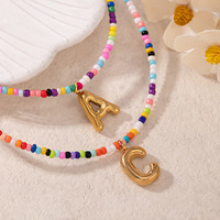 Nouvel Arrivage Collier Perlé Fait Main avec Perles de Rocaille Colorées et Lettres Bulles, Chaîne de Clavicule Délicate Style Bohème Plage