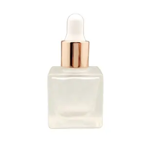 Leere 10ml quadratische Würfel-Milchglas-Tropf flasche mit rosé goldener Tropf kappe für kosmetisches Nagel hautöl
