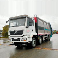 Camion de transfert et de compactage des déchets Shaanxi Automobile Delong, Usine de production, Camion à ordures robuste de 30 m³ avec châssis d'ingénierie
