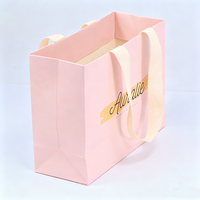 Fournisseur de sacs en papier pliables de luxe personnalisés avec poignées en ruban, pour la promotion de la mode, les cadeaux, les cosmétiques et les parfums, couleur rose