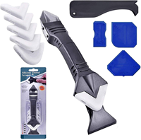 Kit d'outils de finition 3-en-1 en acier inoxydable avec racloir à silicone pour l'élimination du mastic et du coulis