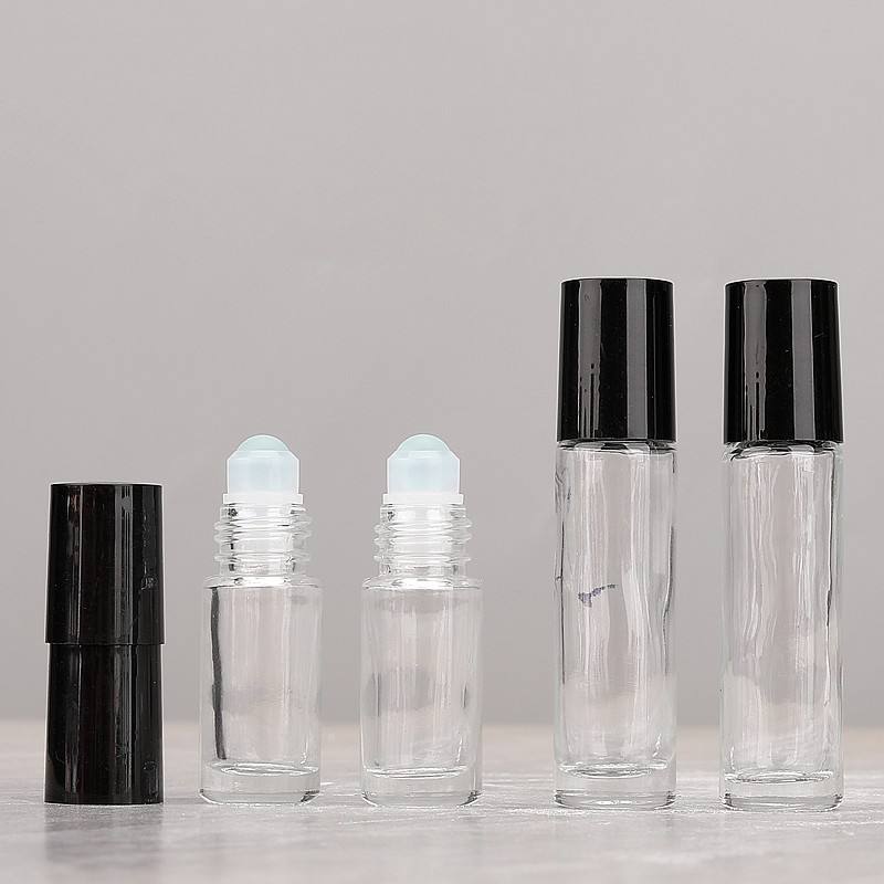 Clear bottle + glass ball + black plastic cap