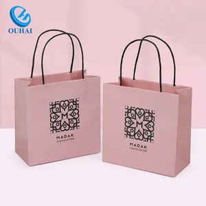 Bán buôn Logo tùy chỉnh và kích thước các tông màu hồng cán túi giấy cho bán lẻ mua sắm Khuyến mãi Bao bì Doanh Nghiệp Nhỏ