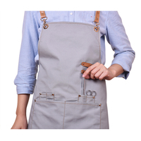 Tablier de travail pour barbier en toile lavée avec sangle noire