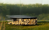 Table ronde de qualité pour repas et grillades avec fonctionnalité de barbecue