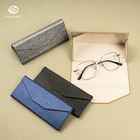 Alibaba Meilleure vente boîte à lunettes en cuir Logo personnalisé étui à lunettes pliant Triangle étuis à lunettes étuis à lunettes en gros