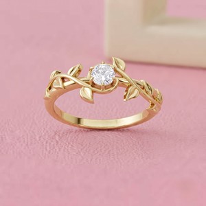 Anillo de compromiso solitario de diamante redondo con engaste oculto para joyería nupcial fina de diseño moderno - Product Image 1