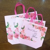Vente en gros de sacs à provisions en PE noir thermoscellés avec impression offset à long manche pour l'emballage de vêtements étanches avec logo