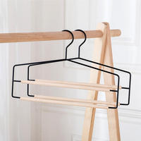 Cintre à pantalons multi-niveaux en métal et fer avec barres rondes en bois pour armoire et séchage du linge
