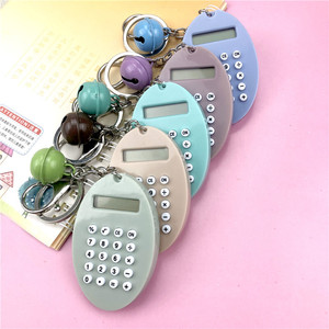 Oval Macaron Colored Calculator Mini Portable Keychain With Bell For Bag Or Computer - Product Image 1