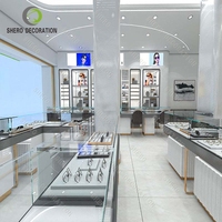 Vitrine d'exposition de lunettes optiques LED personnalisée avec étagères murales en bois et éclairage LED pour le rangement des lunettes