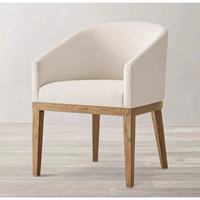 Chaise de salle à manger Rh Black Farmhouse Light, style scandinave contemporain, en bois massif et rotin, avec accoudoirs, dossier et coussin en tissu Cortex.