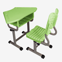 Ensemble de bureau et chaise scolaire moderne, trapézoïdal, modulaire, écologique, réglable en hauteur avec mécanisme à bouton manuel pour l'étude des élèves