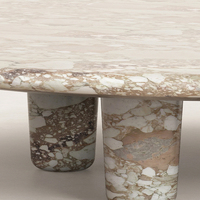 Table basse ronde de luxe en marbre avec pieds cylindriques épais, table centrale élégante en pierre naturelle pour salon moderne et décoration de villa