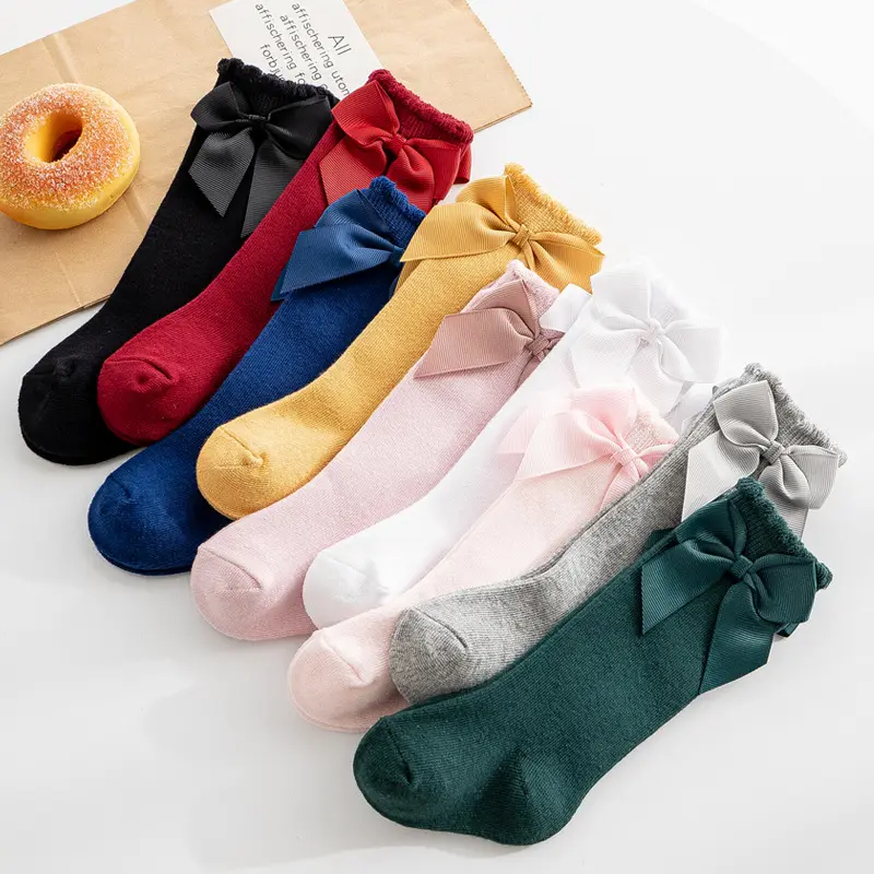 Pouco quente infantil fabricante espanhol coreano bonito da peúga do bebê Lolita crianças arco algodão bebê joelho meias altas para as meninas