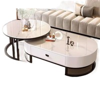 Ensemble de tables basses modernes rondes et ovales imbriquées avec tiroir de rangement, plateau en pierre frittée et structure métallique pour l'ameublement de la maison