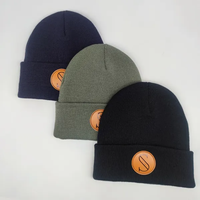 Gorro de invierno al por mayor para hombre y mujer, gorro tejido con etiqueta de parche tejido.