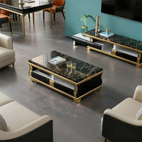 Table basse de luxe en marbre noir avec espace de rangement pratique et piètement en acier inoxydable doré pour salon