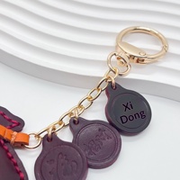 Pochette porte-bonheur best-seller en cuir véritable, pendentif fait main, porte-clés décoratif simple, accessoire de sac au design mignon, nouvelle tendance