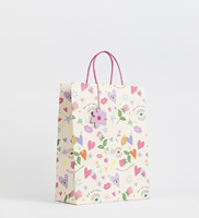 Sacs en papier kraft marron classiques personnalisés avec poignées en corde, finition mate et gaufrée, pour emballage cadeau et promotion en magasin de détail
