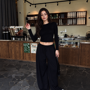 Completo da <span class=keywords><strong>donna</strong></span> <span class=keywords><strong>nero</strong></span> a tinta unita con top a maniche lunghe e <span class=keywords><strong>pantaloni</strong></span> a gamba larga con cintura e coulisse, morbido e casual, loungewear due pezzi OEM - Product Image 1