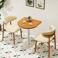 Table basse minimaliste moderne avec chaises rembourrées à structure en bois massif, ensemble table et chaises pour cafés et restaurants