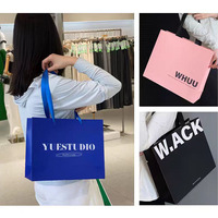 Cadeau de vente au détail de vêtements personnalisés sacs en papier kraft brun bon marché avec poignée de logo de marque utilisation promotionnelle