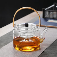 Théière en verre borosilicate transparent résistant à la chaleur, soufflée à la main, écologique, 1000 ml, pour bouillir et faire cuire à la vapeur, compatible feu ouvert