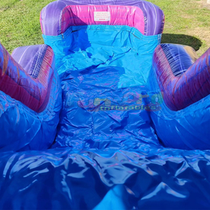 Château gonflable commercial pour enfants, thème palais violet, avec toboggan aquatique et zone de saut. - Product Image 5
