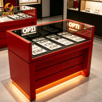 Comptoir de magasin d'optique moderne, design luxueux, présentoir à lunettes en verre avec éclairage LED pour magasin de détail