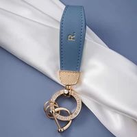 Nouveau porte-clés coloré, simple et écologique en alliage de zinc et cuir PU pour voiture, anti-perte, accessoires haut de gamme, vente en gros