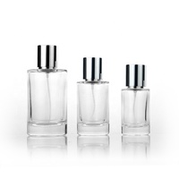 Venta al por mayor 30ml 50ml 100mL botella de perfume de vidrio transparente redonda con tapa plateada