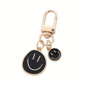 Manufacture Round Smile Metal Keychains Golden Zinc Alloy Offset Printing Stock Keyholder with Pendant Enamel Printed Keychains - Product Image 1