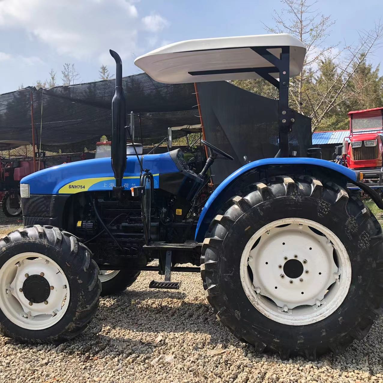 中古ニューホランド754新品タイヤ11.2-24/16.9-30ファーム
