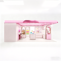 Kiosque pop-up rose pastel pour la beauté, stand de cosmétiques avec éclairage LED complet, présentoirs arqués, comptoirs modulaires, design imperméable