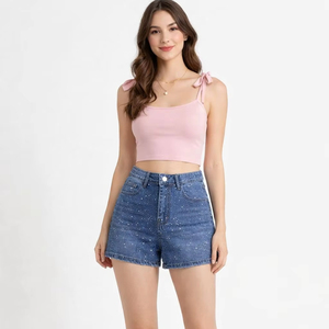 Cómodos shorts de mezclilla de cintura alta y corte ajustado con adornos de pedrería, perfectos para el verano. - Product Image 1